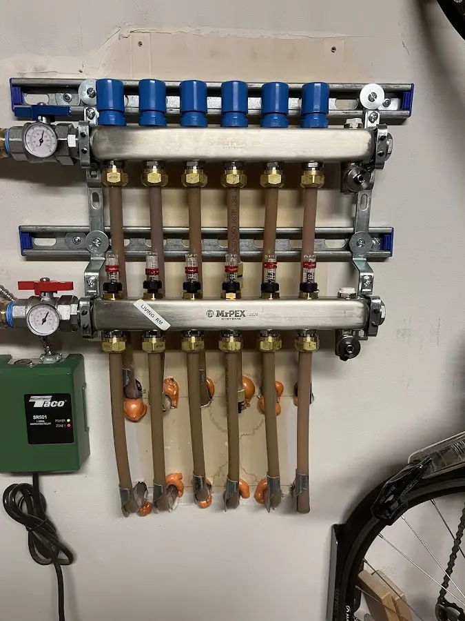 Plumber performing Water Heater Repair at a residential property in Midway